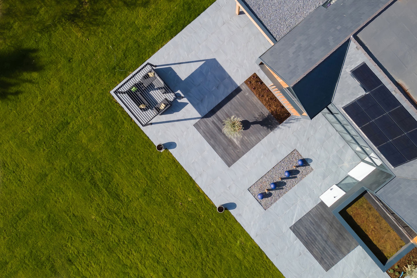 drone image, drone photograph, looking down above house, patio, terrace, lawn, new build house, architects, aerial photograph