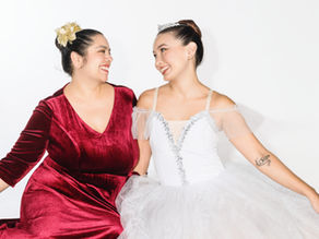 two adult ballerinas wearing their costumes for The Nutcracker performance