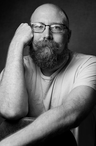 Black and white arm lean headshot
