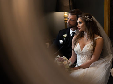 Couple Poses in Front of Luxury Mirror in VIP Suite at Crystal Ballroom Lake Mary.