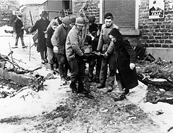 LA GLEIZE, BELGIUM - FEB 1, 1945_ Monuments Man Walker Hancock (front left, in U.S. Army h