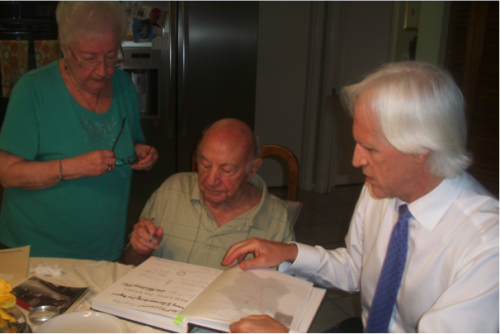 Rouben’s wife, Lee, and I look on as Rouben Sami signs a copy of Rescuing Da Vinci. Each one of the Monuments Men and women I’ve interviewed has signed this book making it the most rare and treasured document among hundreds in the collection of the Monuments Men Foundation.
