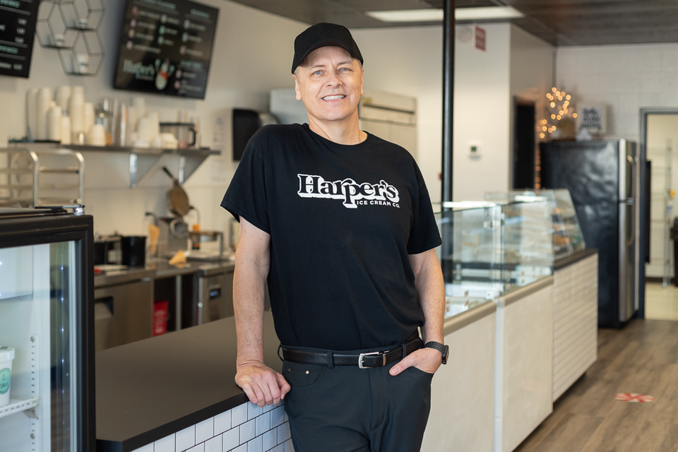 a man wearing a black Harper's t-shirt