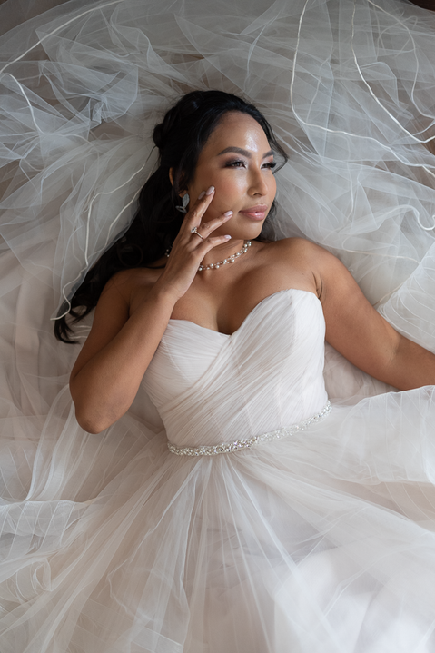 Photo of bride in white wedding dress