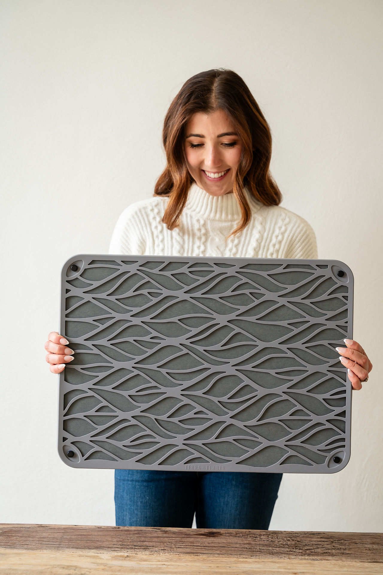 A women holding a drying mat. 
