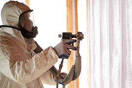 A picture of an installer completing a spray foam insulation project_