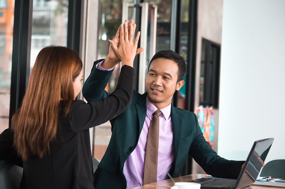 smiling-coworkers-give-high-five-in-the-office-2026-09-24-22-06-02-utc.jpg