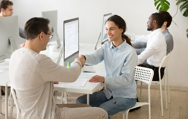 smiling-young-woman-handshaking-satisfied-client-making-deal-office.jpg