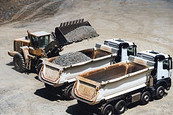 dumper-trucks-being-loaded-on-ore-mine-works-at-o-2024-09-22-22-13-39-utc.jpg