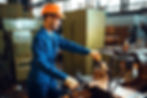 worker-in-uniform-and-helmet-works-on-lathe-2024-12-03-00-10-35-utc.jpg