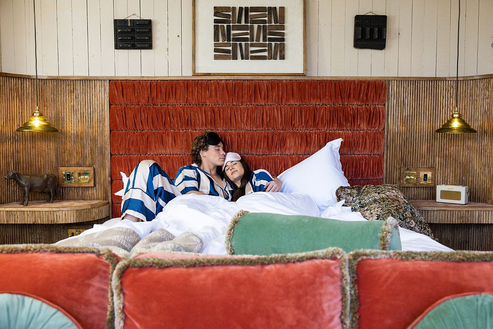 Couple sleeping at Outbuildings Dorset