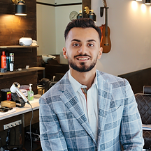 Experienced male barber from Europe, European barber, UK barber, England barber specializing in layered scissor cuts and textured hairstyles for all hair types—proudly serving clients from Prosper, Allen ISD, and Trinity Falls. Kia worked at Floyd's but decided to take the next step in his career to deliver an elevated barber experience!