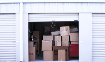 Storage unit cleanout. Storage unit full of boxes.