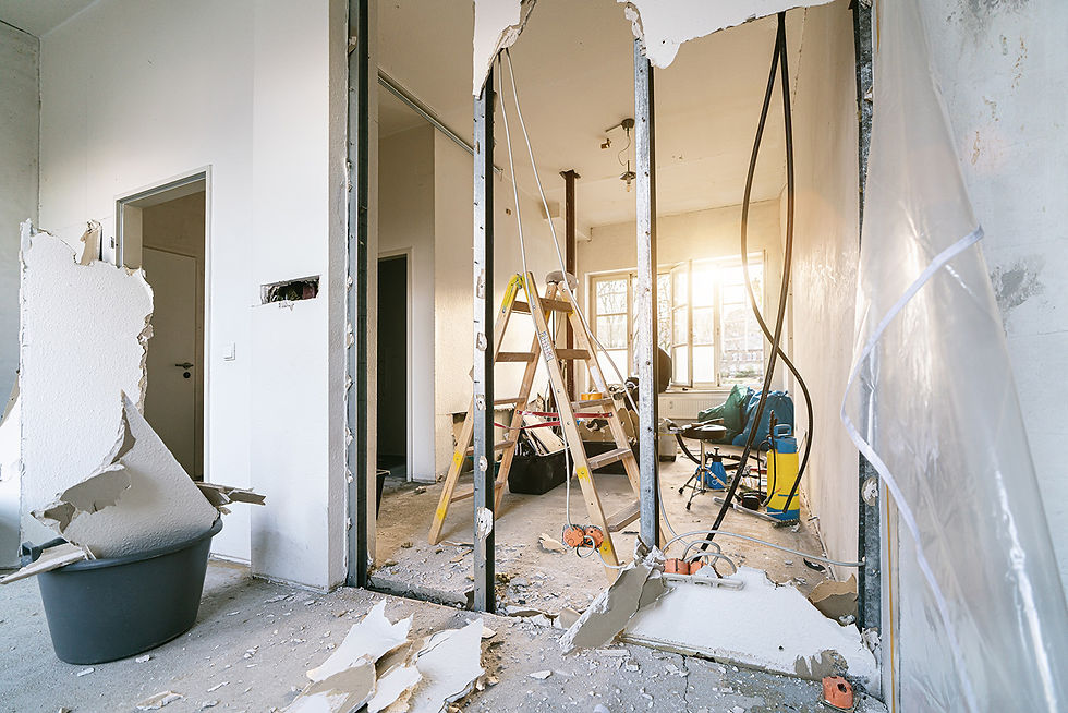 An interior wall knocked with tools around