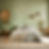 Bedroom with green lime-washed walls, plants and shelves