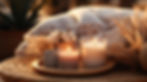 Two candles on a wooden plate