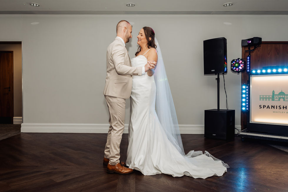 Bride and groom dancing at their wedding reception.