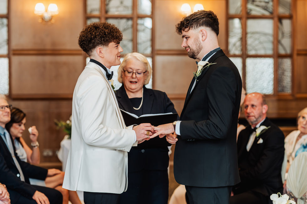 Two people exchanging vows at a wedding ceremony.