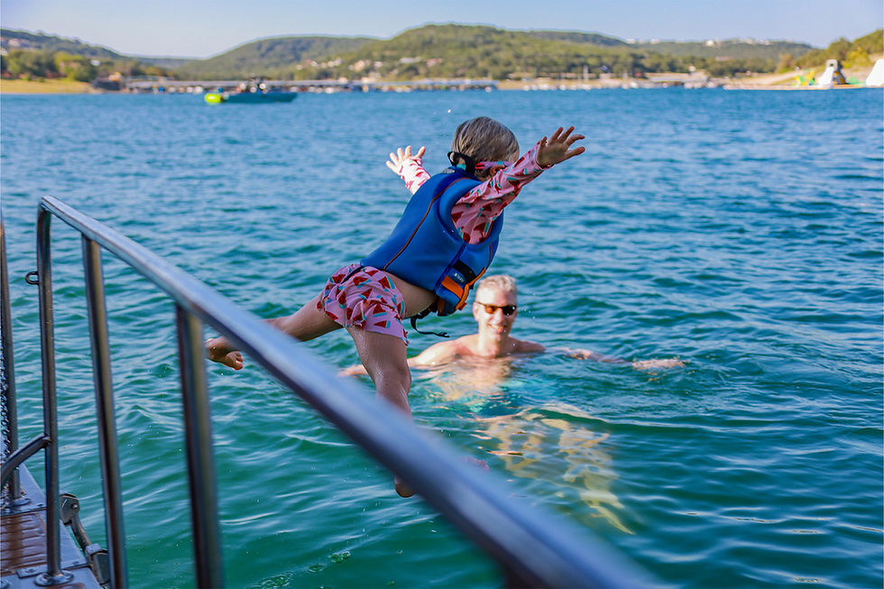 luxury-yacht-water-activities-child-jumping-lake-travis
