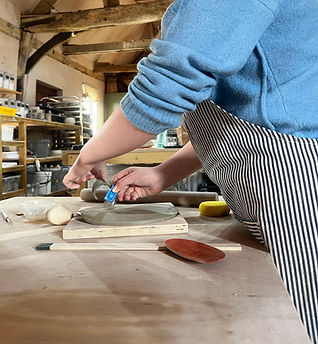 teenager working with clay