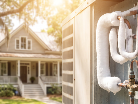 Frozen copper refrigerant lines on an outdoor AC unit at a home in Mount Pleasant, SC.