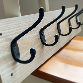 Rustic white washed coat hook with black hooks