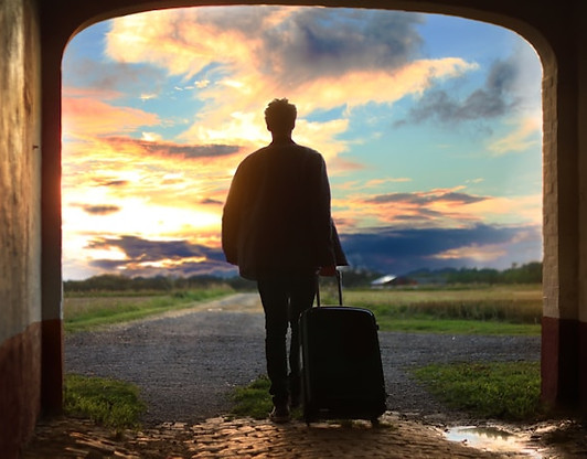 man with a suitcase walking towards his new life.jpg