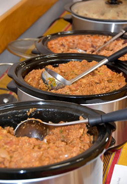 The Ugandan dishes in cooking pots ready to serve at our Pajule lunch.