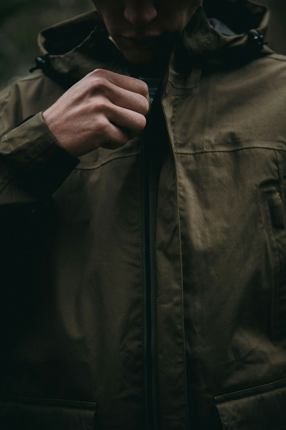 A man wearing a waxed jacket