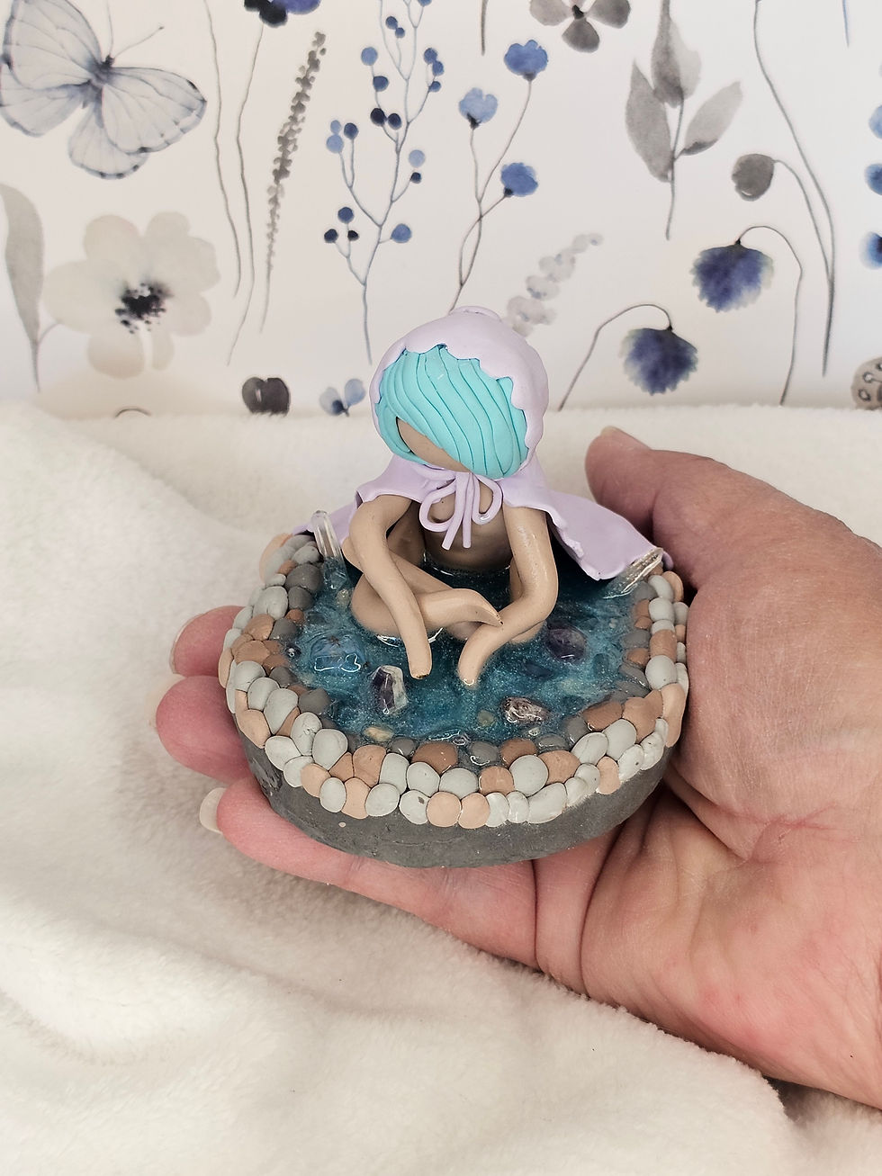 “She is the mirror that asks you to look within and honor every part of yourself.”