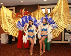 Show Girls and Stilt Walkers