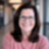 lisa knight has brown hair, blue eyes and glasses.
