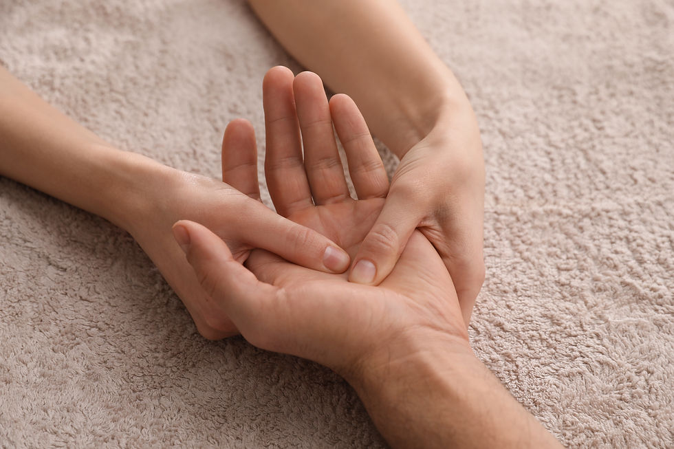 Man receiving hand massage on soft towel, closeup.jpg