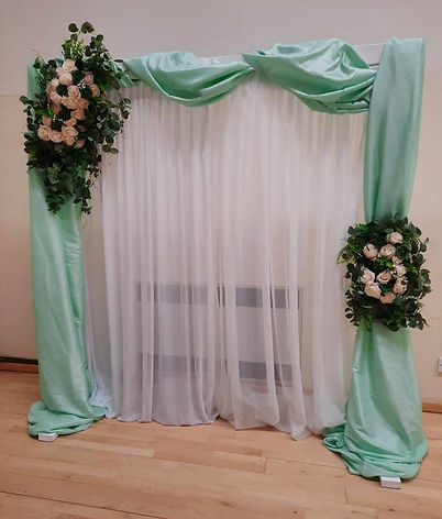 White Wooden Rustic Arch decorated flowers material hire