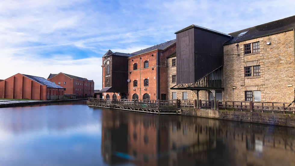 A landscape picture of The Orwell building at Wigan Pier along the canal.