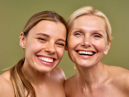 two women with clear rejuvenated skin for anti-aging via hydration, antioxidants, Biotin, ALA, Glutathione
