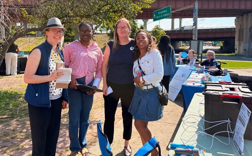 Founder Brittani Hall with community partners at a SYNC outreach event.