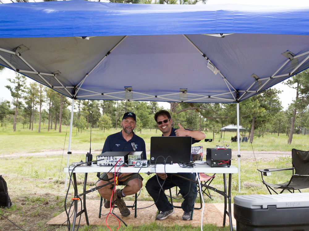 Two ham operators at field day running a portable station.