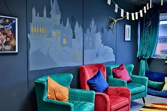Colourful comfortable chairs in a Harry Potter themed space