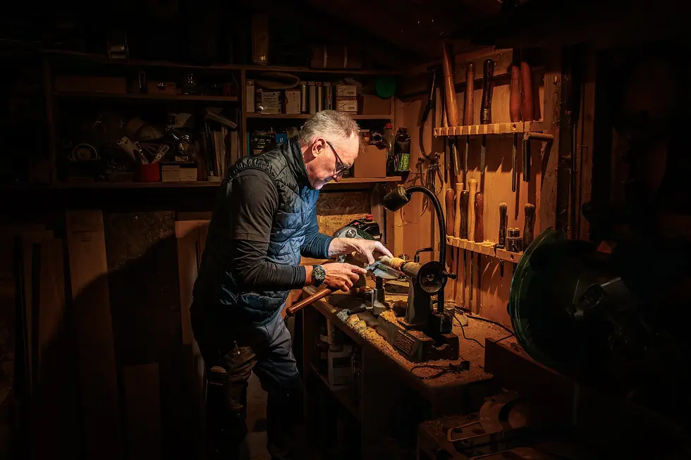 Owen in his workshop turning wood