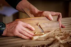 Hands using lathe