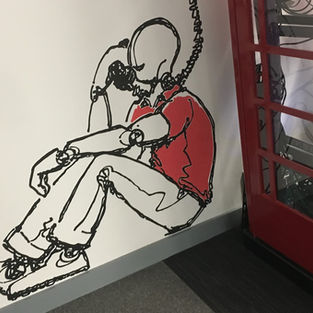 Evoke Creative Limited Bromborough mural of man sitting