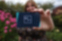 Rachel Hough L&D consultant holding her business card