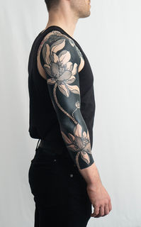 lotus flower blackout tattoo by kevin ligabue oakland california bay area ig kevinligabue