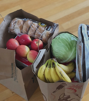 Paper bags with groceries including frui