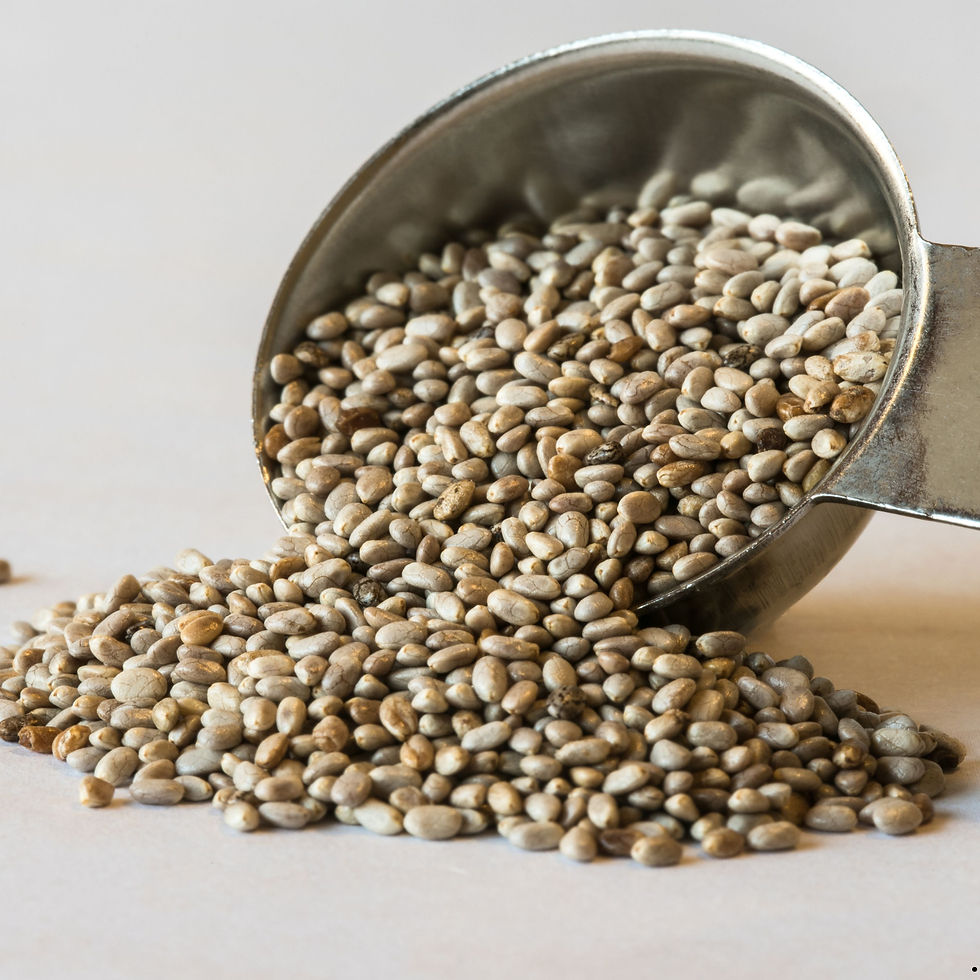 Miniatura: A large spoon of spilled white chia seeds.