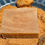 Thumbnail: A single Fig and Brown sugar bar of soap on a bed of brown sugar.