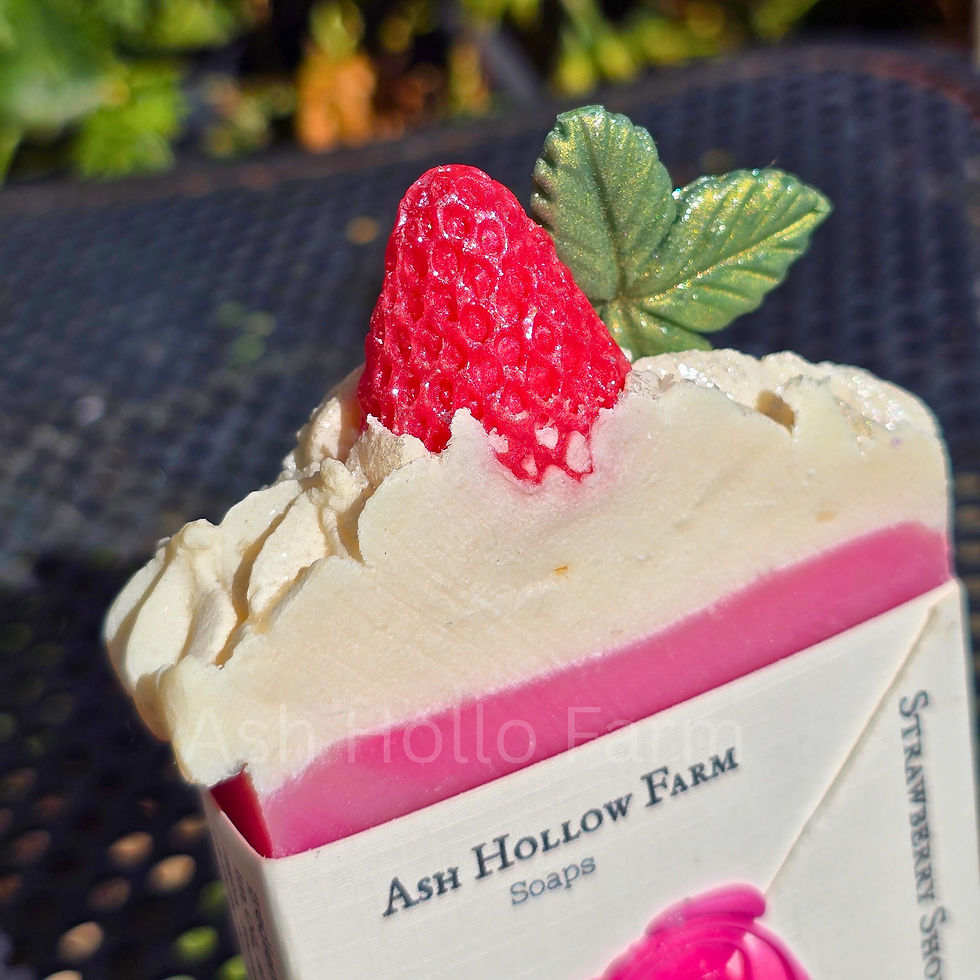 Thumbnail: Two bars of our homemade strawberry shortcake soap.