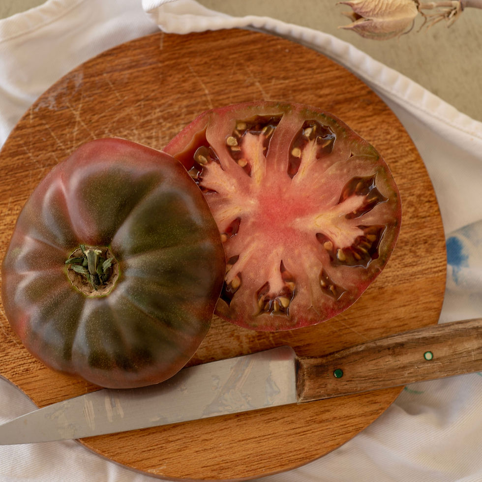 Thumbnail: A sliced Black from Tula on a round cutting board.