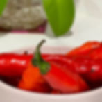 Thumbnail: A few Aji Limon chilis in a white dish.
